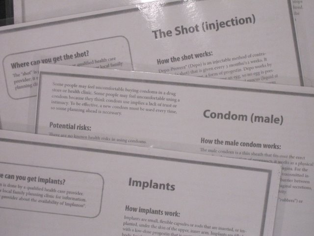Informational fliers on The Shot (injection), Condom (Male) and Implants.